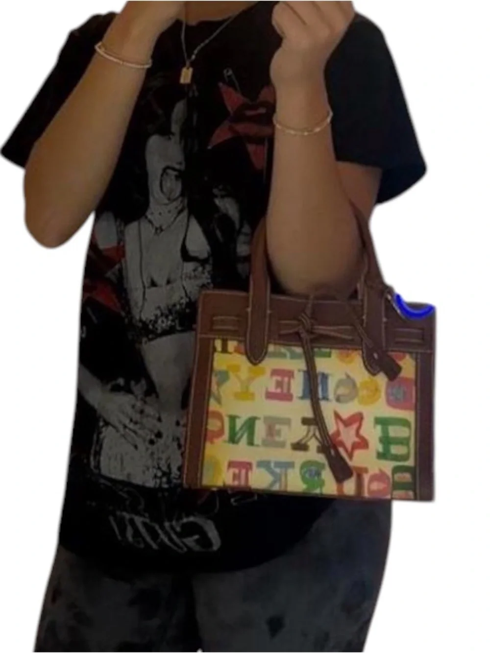 Dooney & Bourke graffiti signature multicolor coated handbag.